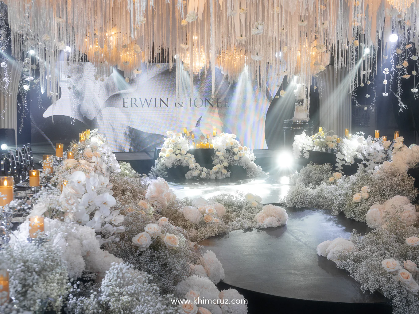 a timeless winter-themed wedding using white Phalaenopsis and florals enclosing the wedding dance floor