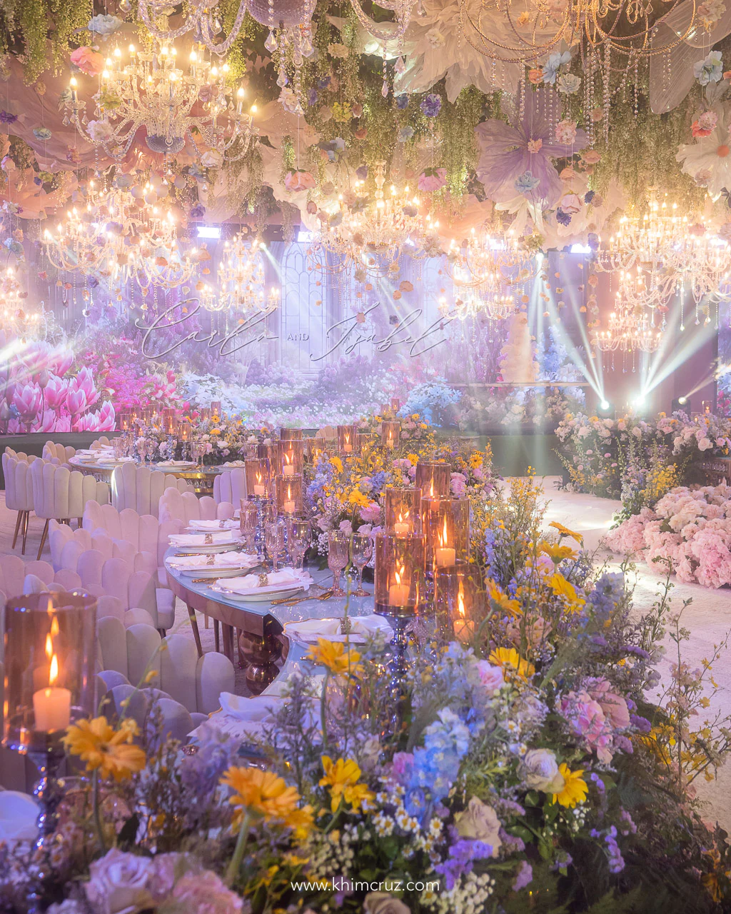 dreamy spring garden-inspired wedding reception with elegant curvy table settings and lush floral centerpieces