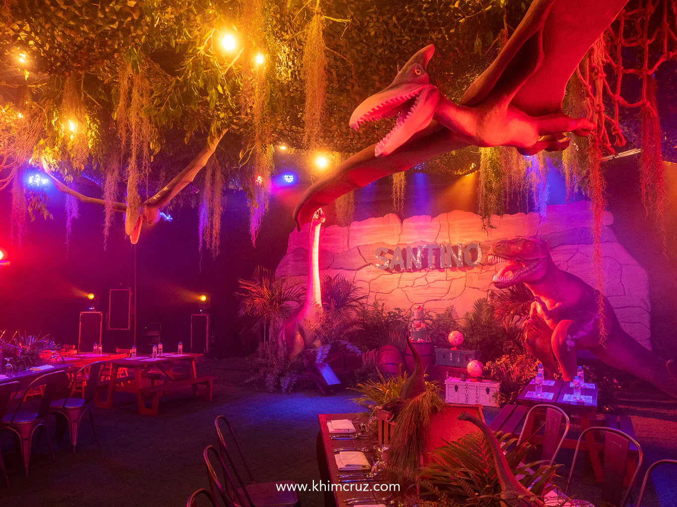 Pterodactyls soar overhead adding a touch of prehistoric magic to this dinosaur-themed birthday celebration