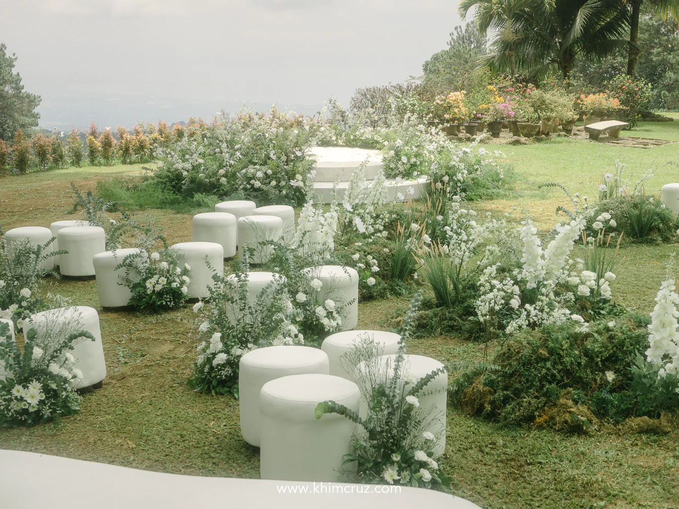 bespoke outdoor wedding with lush white florals and a overlooking view of the city