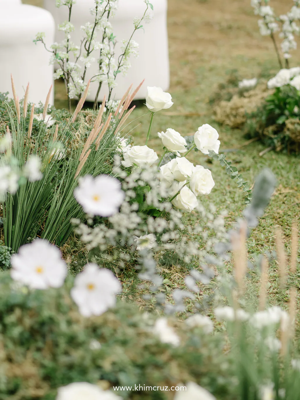 lush white floral design for a bespoke outdoor wedding ceremony