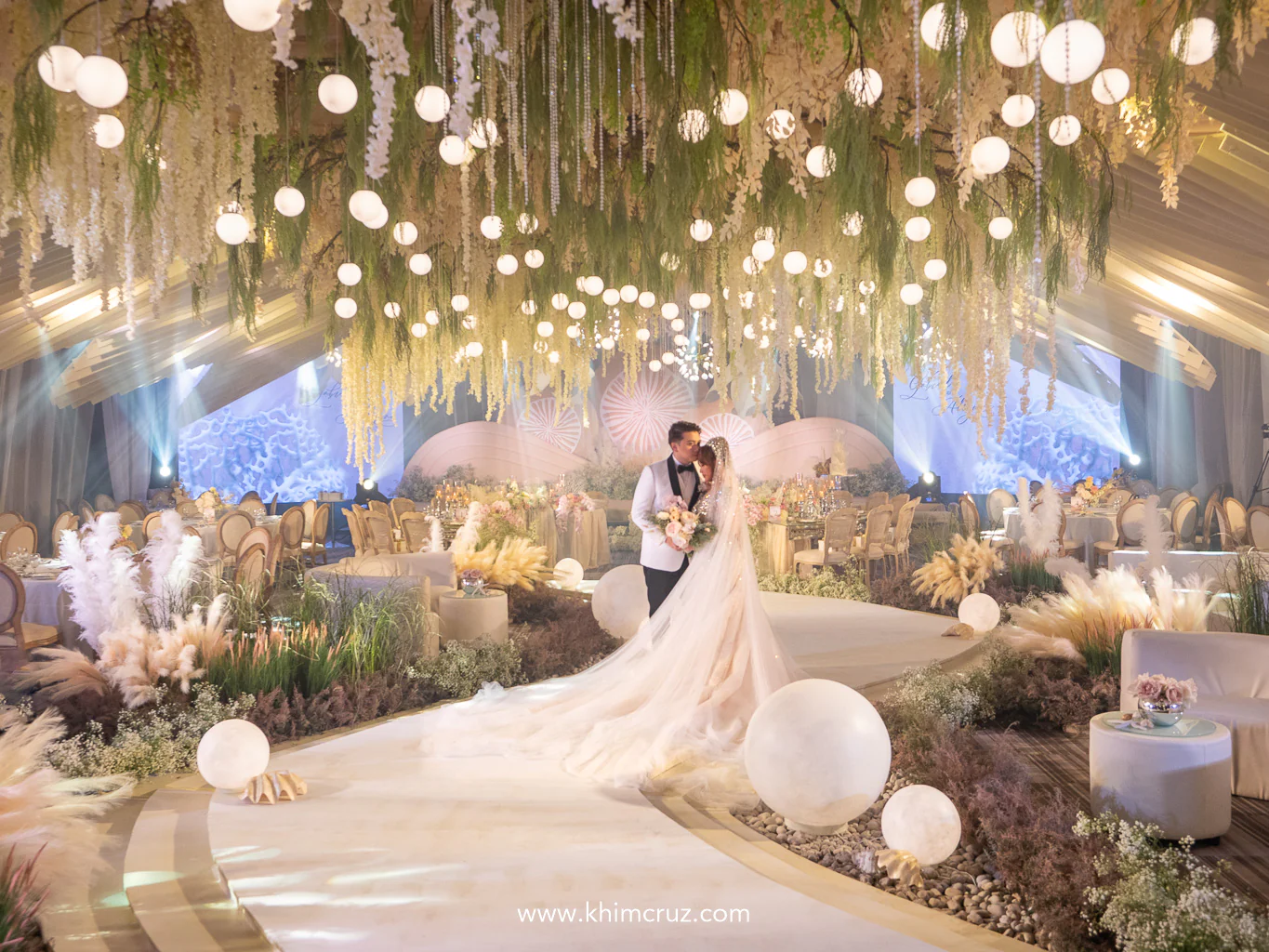 an earthy seaside theme wedding reception featuring shoreline inspired walkway