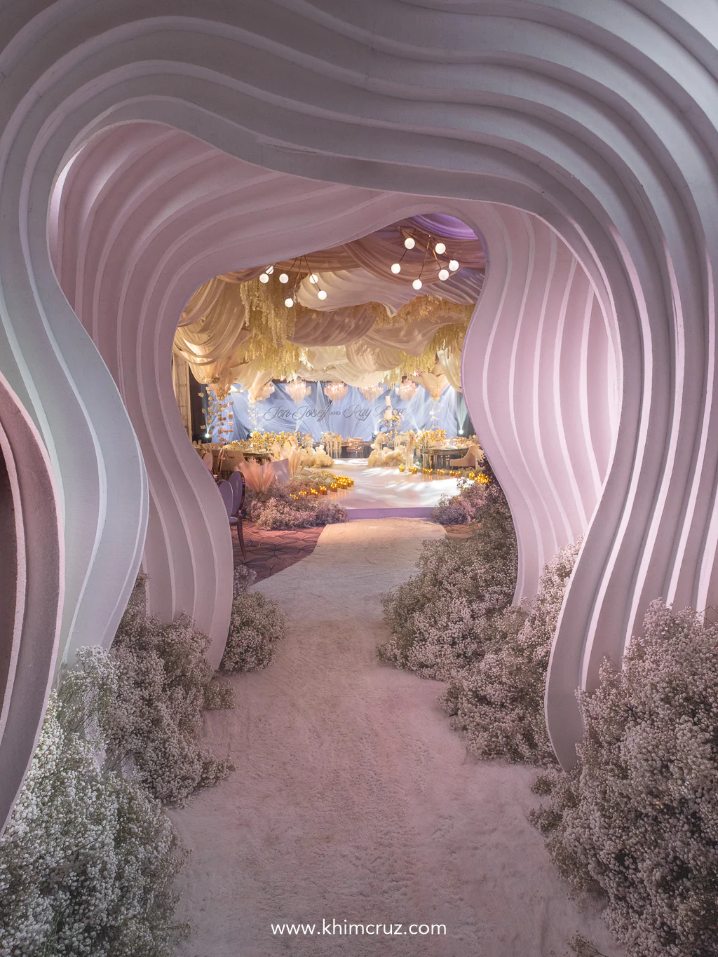 beautiful multi-layered curvy tunnel at the entrance of wedding reception