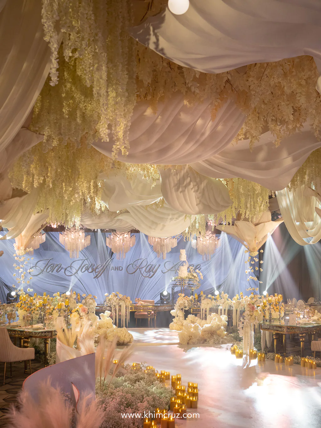 delicate drapings in soft tones paired with lush organic floral arrangements for the wedding