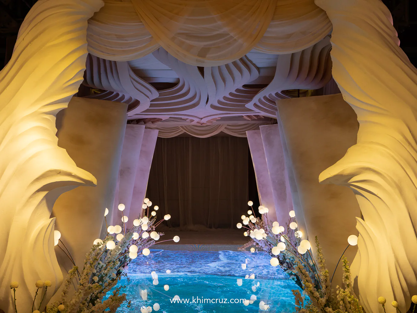 seashore-inspired entrance tunnel with flowing wall and ceiling design