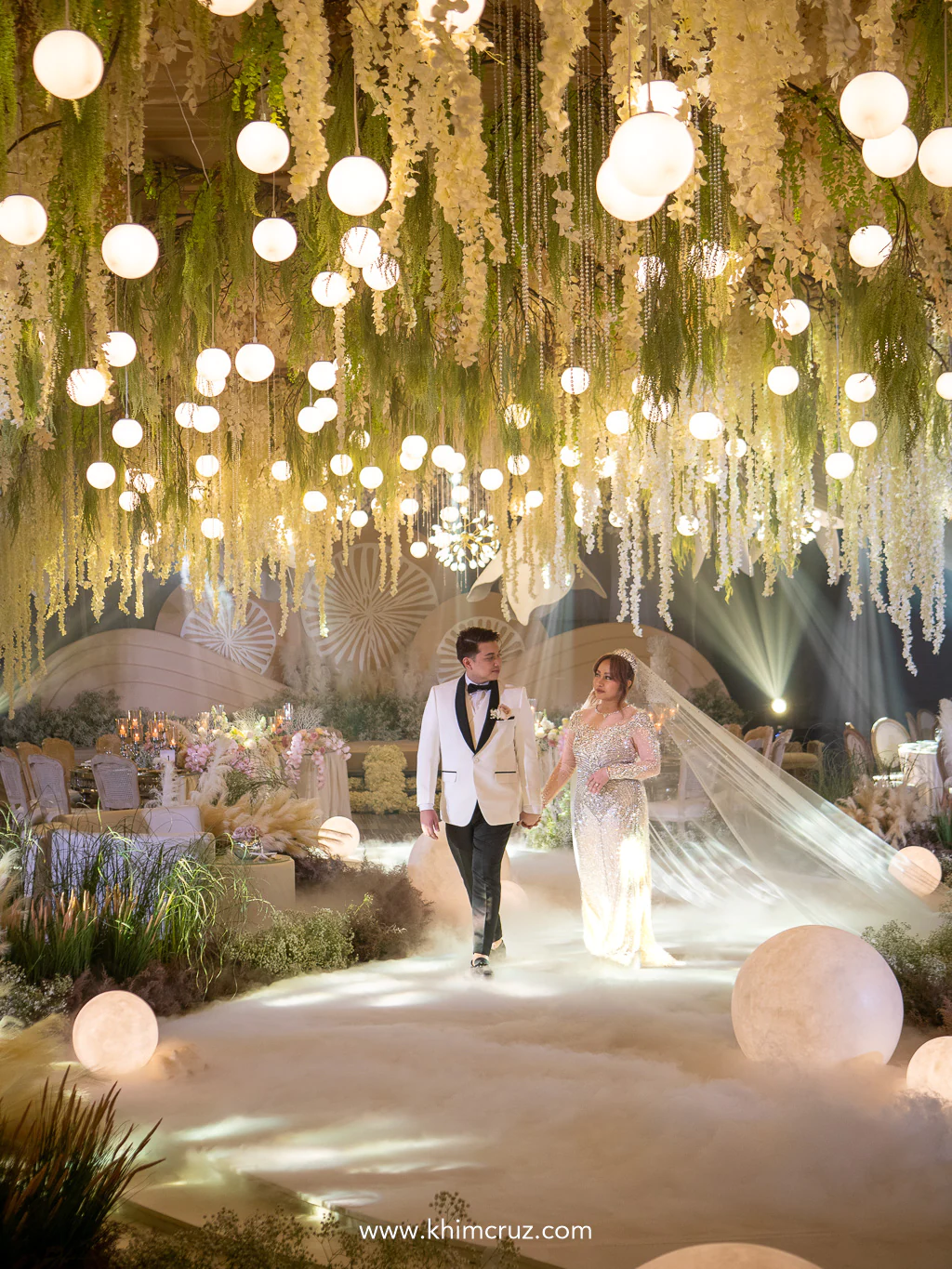 the couple walking down its shoreline-inspired walkway in this earthy seaside theme wedding