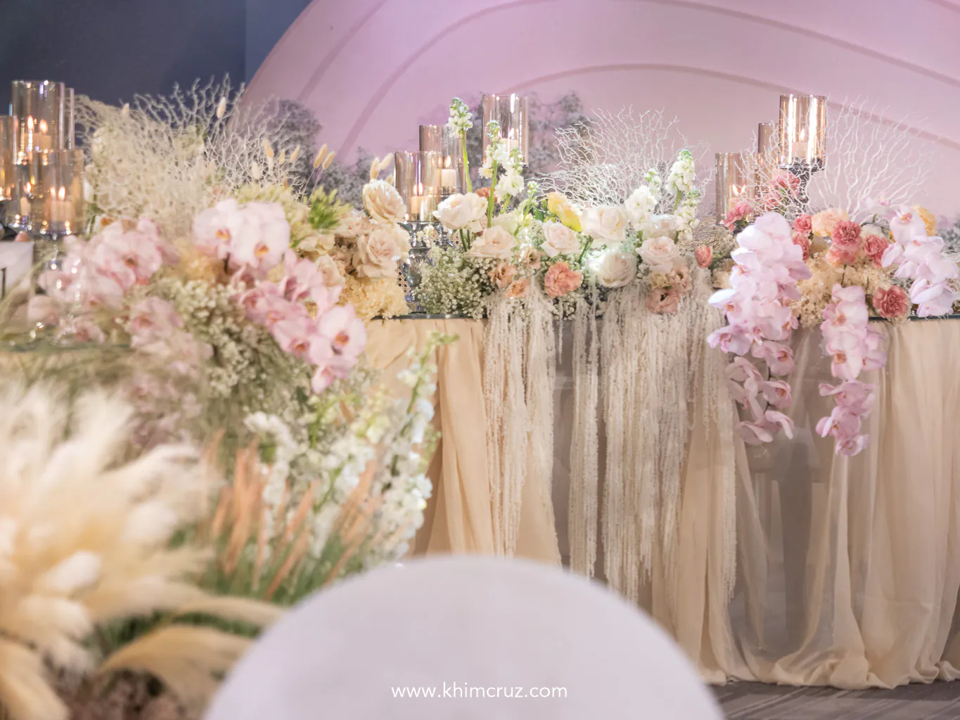 wedding table adorned with cascading orchids perfectly capturing the elegance of a sea-inspired theme