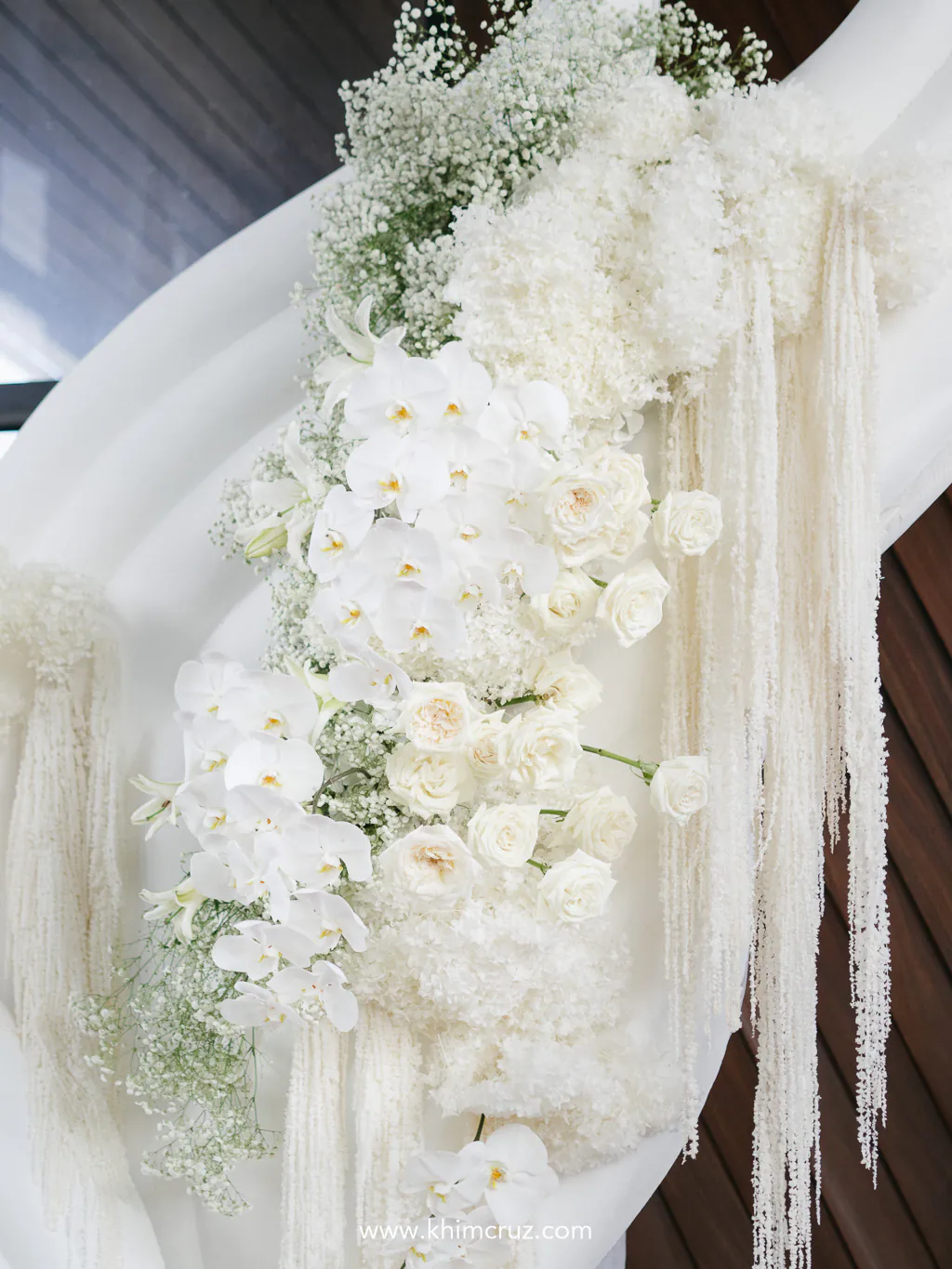 captivating structure draped in cascading white blooms