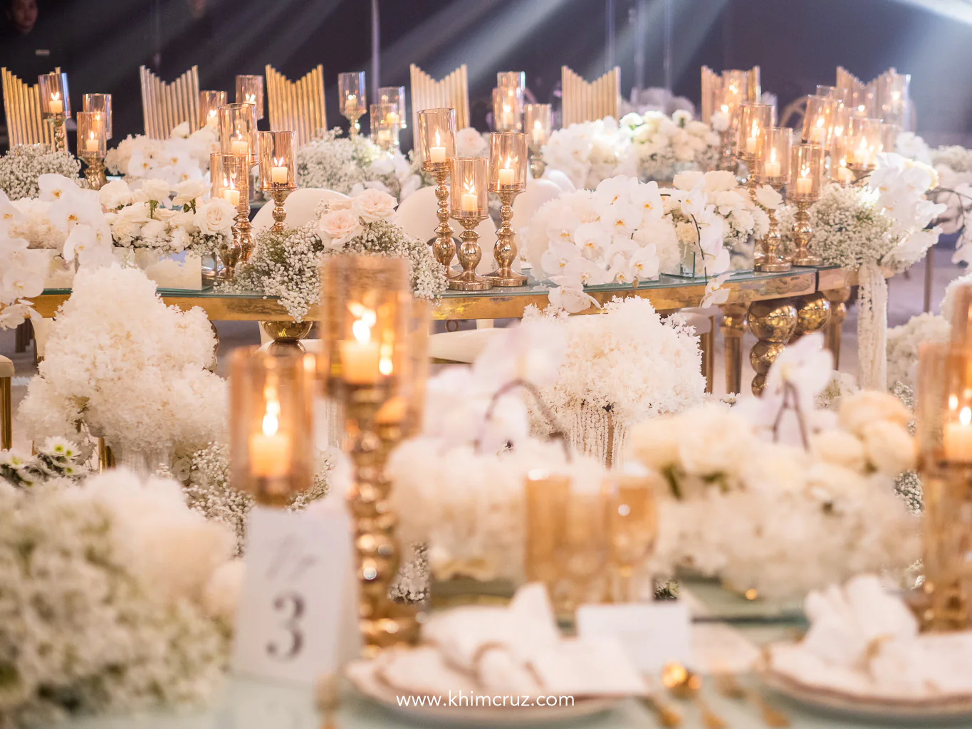 dreamy white florals and the warm glow of candles set the mood for an ethereal and elegantly romantic wedding