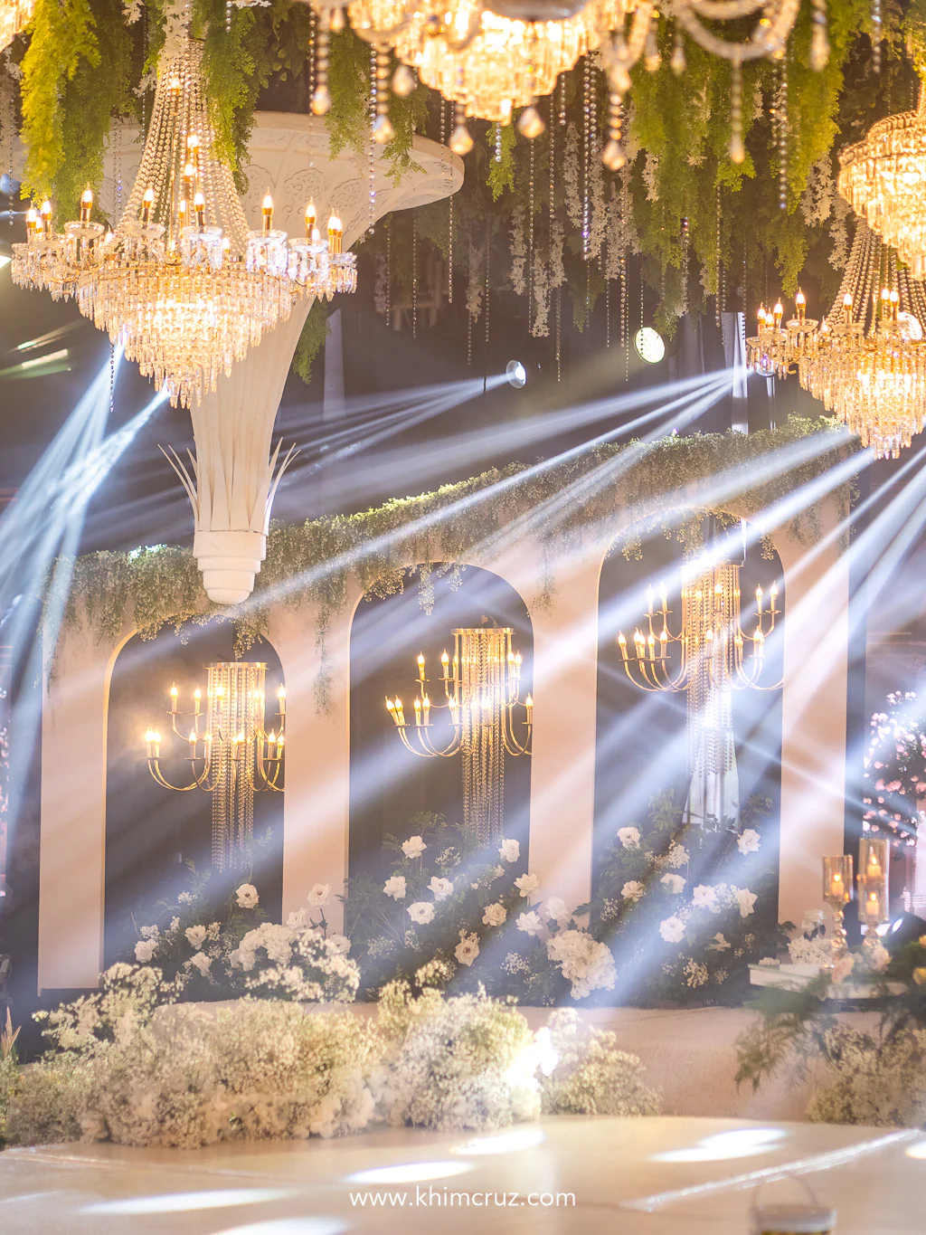 structural arches and chandeliers on garden-inspired wedding